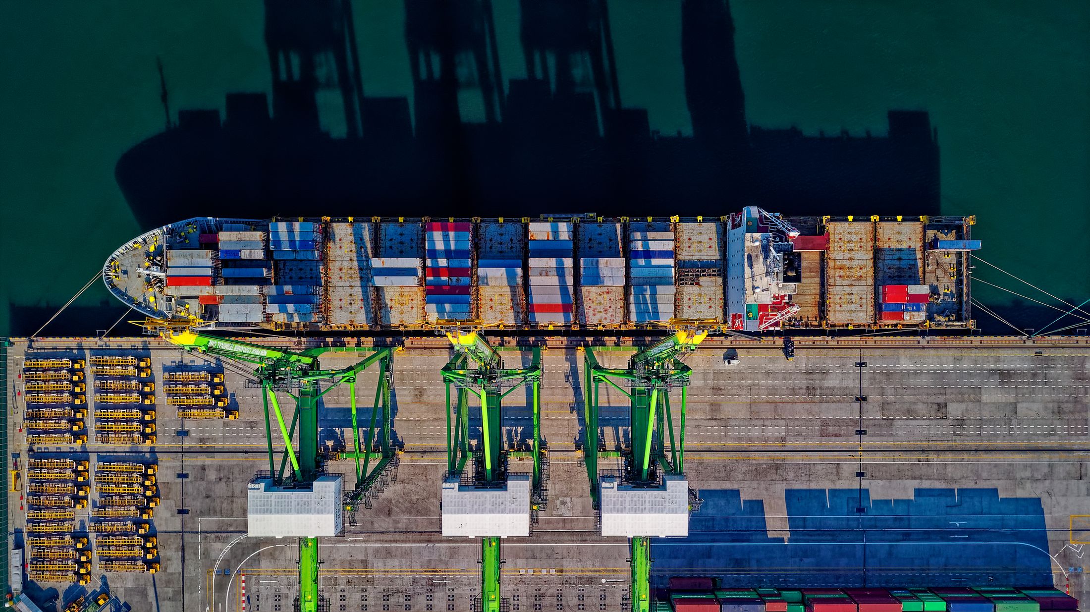 Ship-to-shore cranes handling heavy cargo at a port